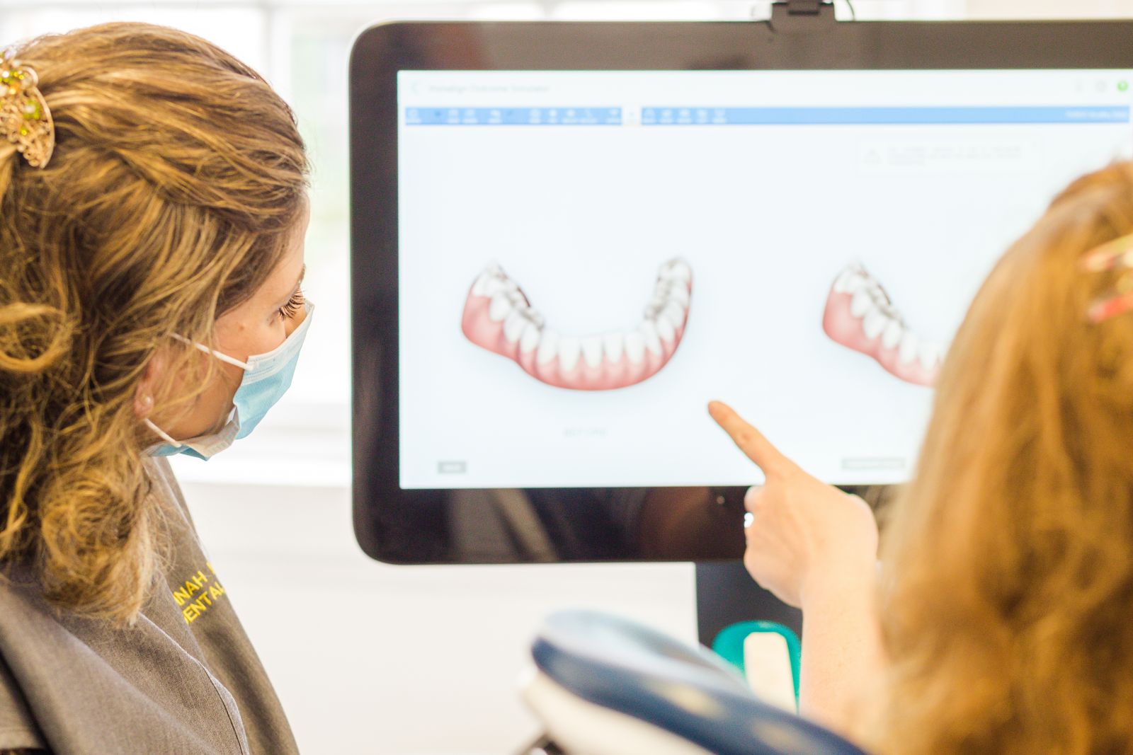 Patient being shown her smile in a 3D scanner