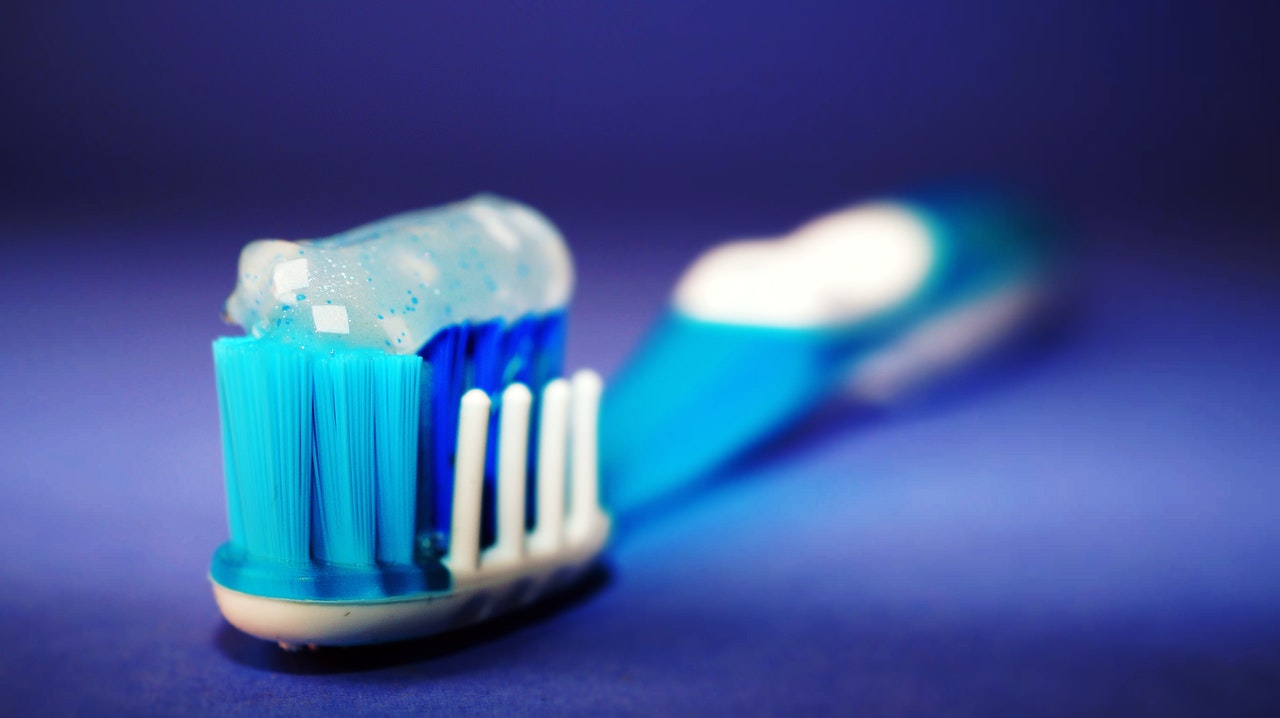 toothbrush - brush regularly to take care of dental implants
