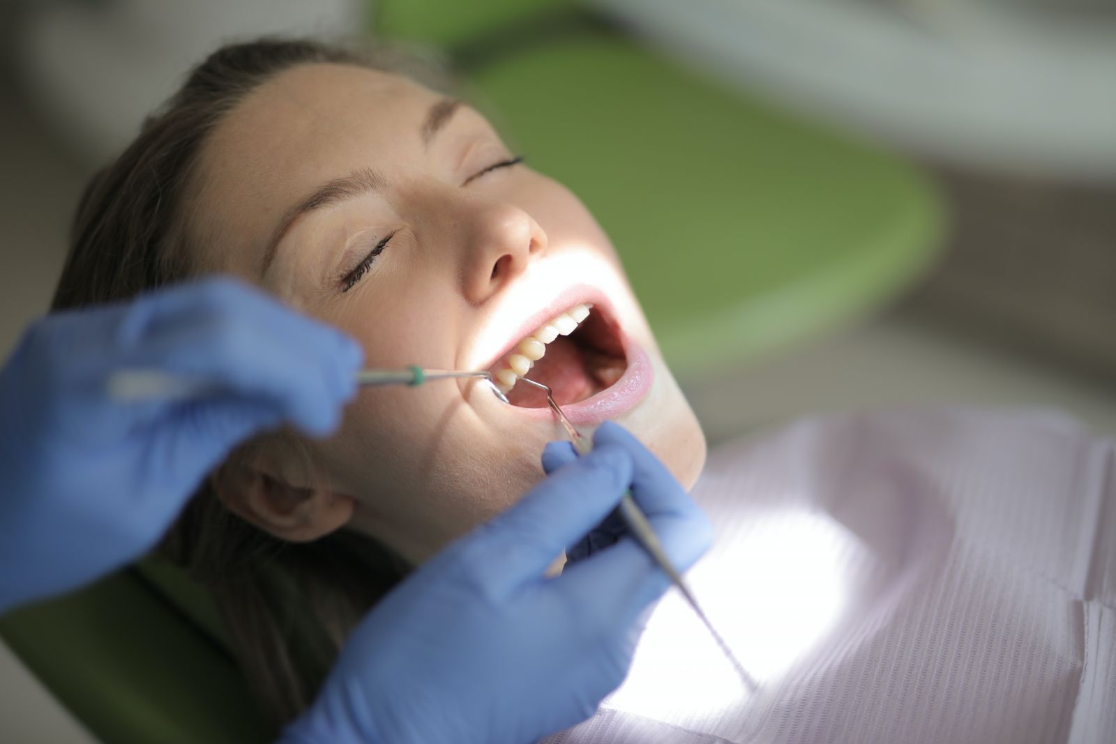 woman in dentist chair getting treatment